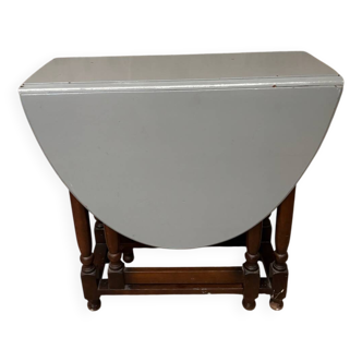 Oval wooden table with flaps