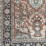 Wool and silk rug with a vegetated décor on a pink background, blue-bottomed border 157 x 91 cm