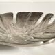 Leaf-shaped metal pocket emptier