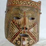 Terracotta mask with geometric decorations