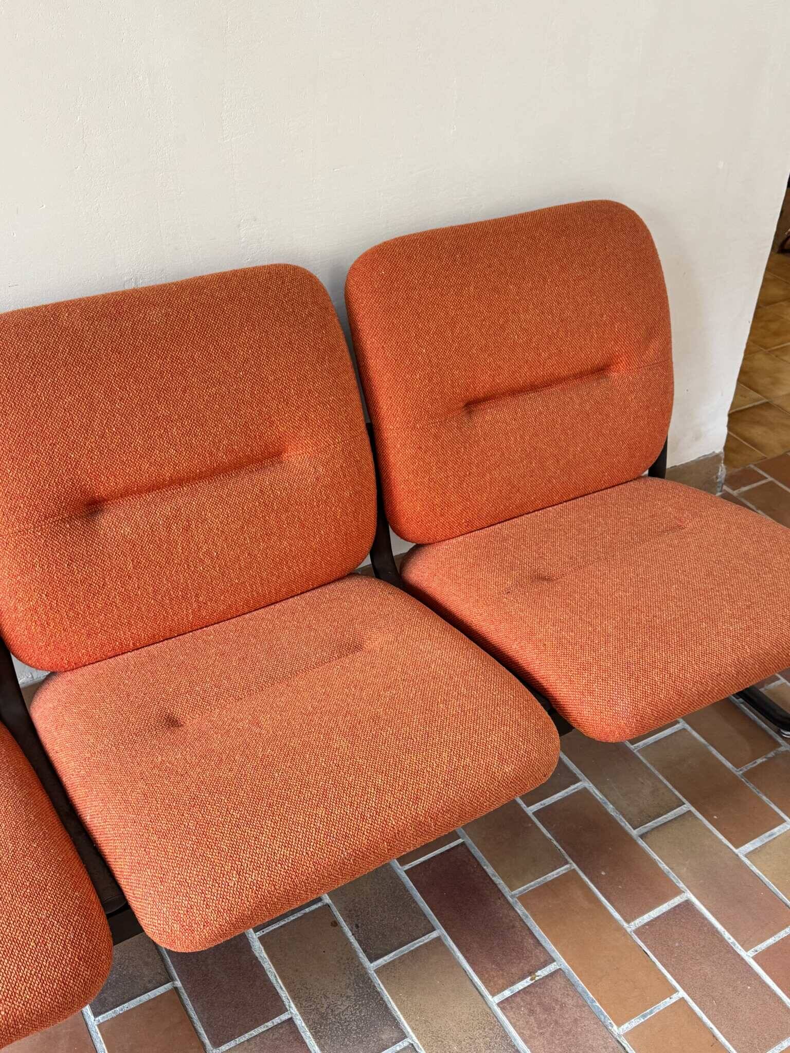 Strafor 3-seater bench, orange upholstery and sled base, 1970s.