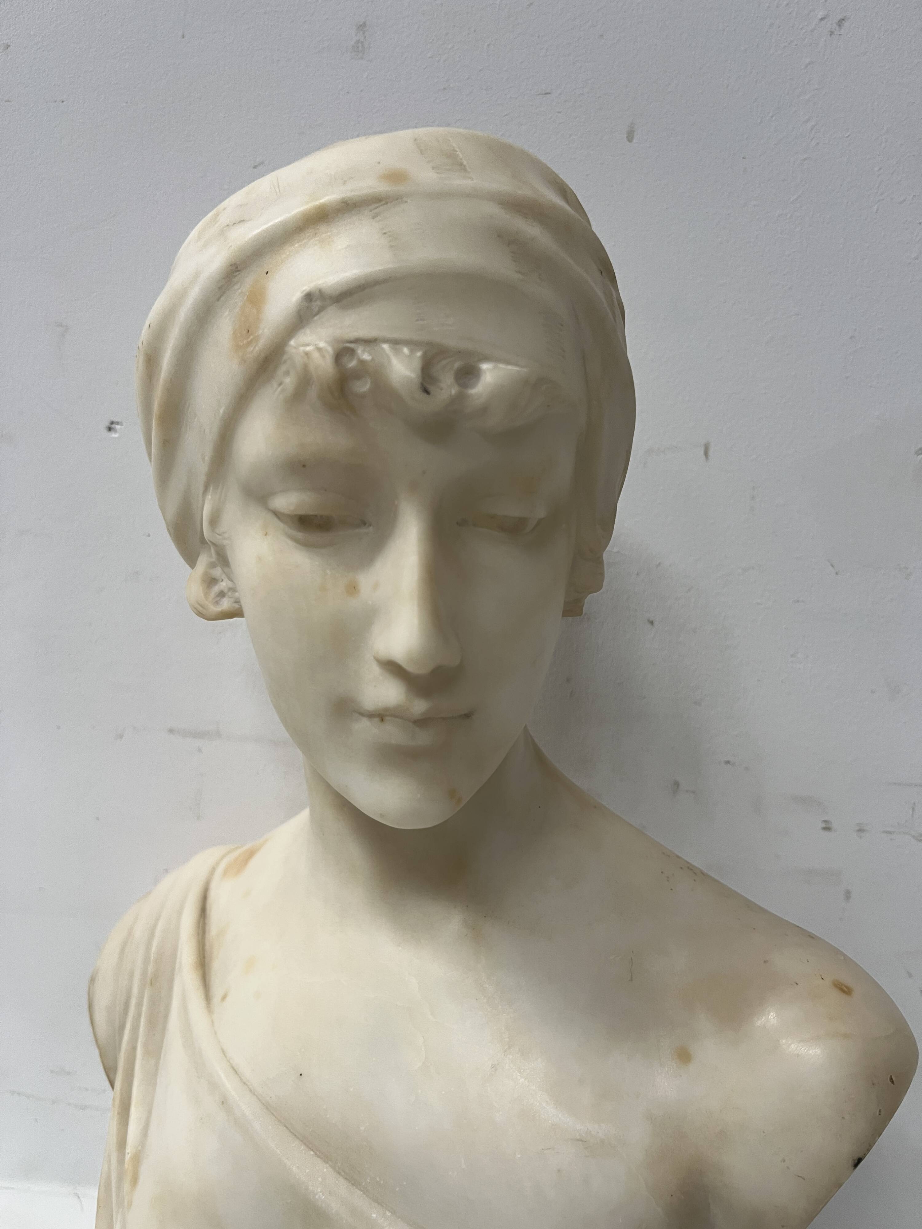 Sculpted marble group of a young woman's bust, 20th century.