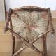 Antique chair with coloured rush seating.