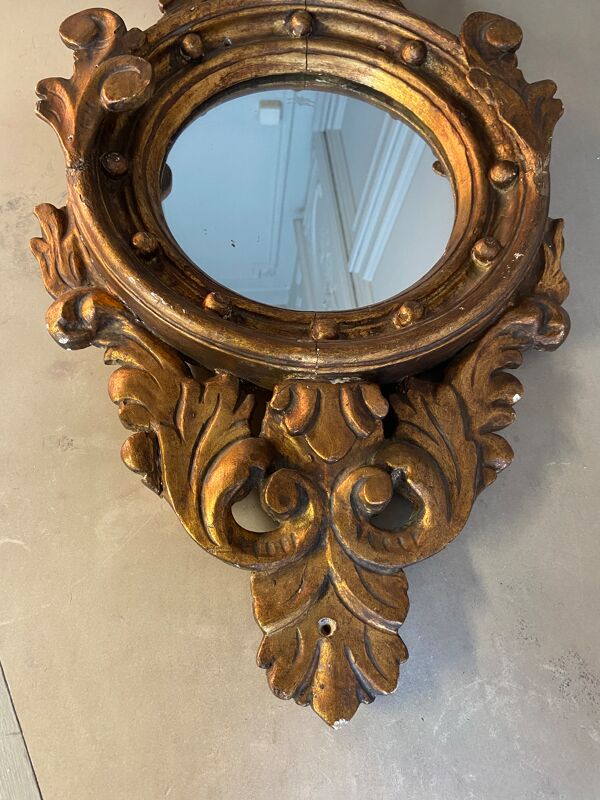 Miroir en bois doré Empire à décor d’aigle 40x97cm