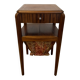 Art Deco sewing table in walnut with a foldable shelf.