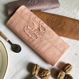 Set of four old damask towels dyed in multiple colors