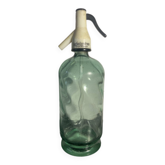 Old transparent glass siphon
