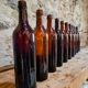 Set of 10 bottles of old Bordeaux French wine in ruby brown glass, 19th century.