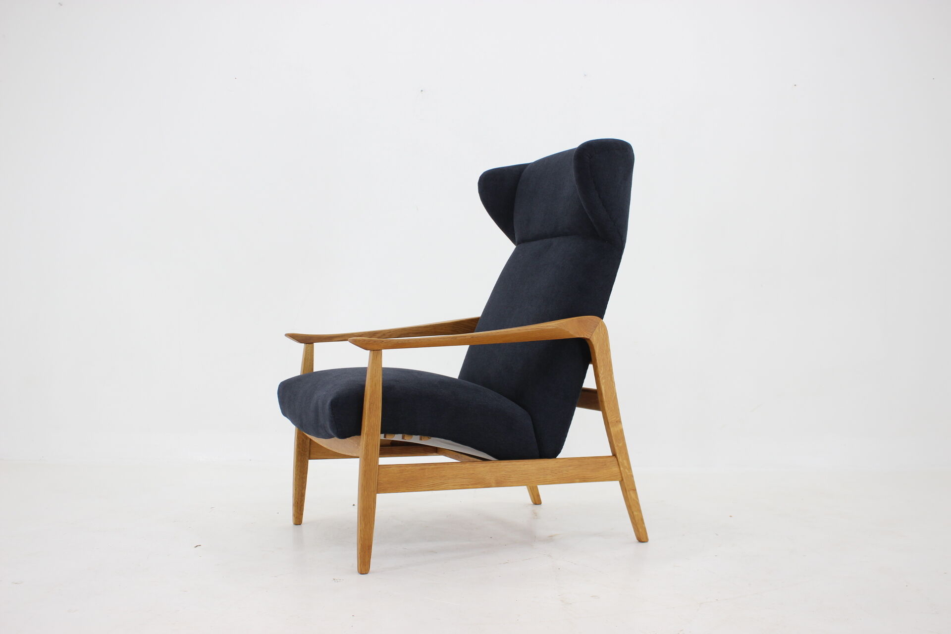Oak reclining wing chair, czechoslovakia, 1960
