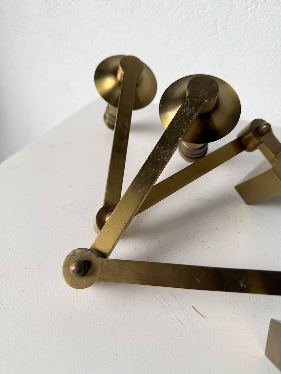 Pair of brass wall lights with articulated arms from the 70s