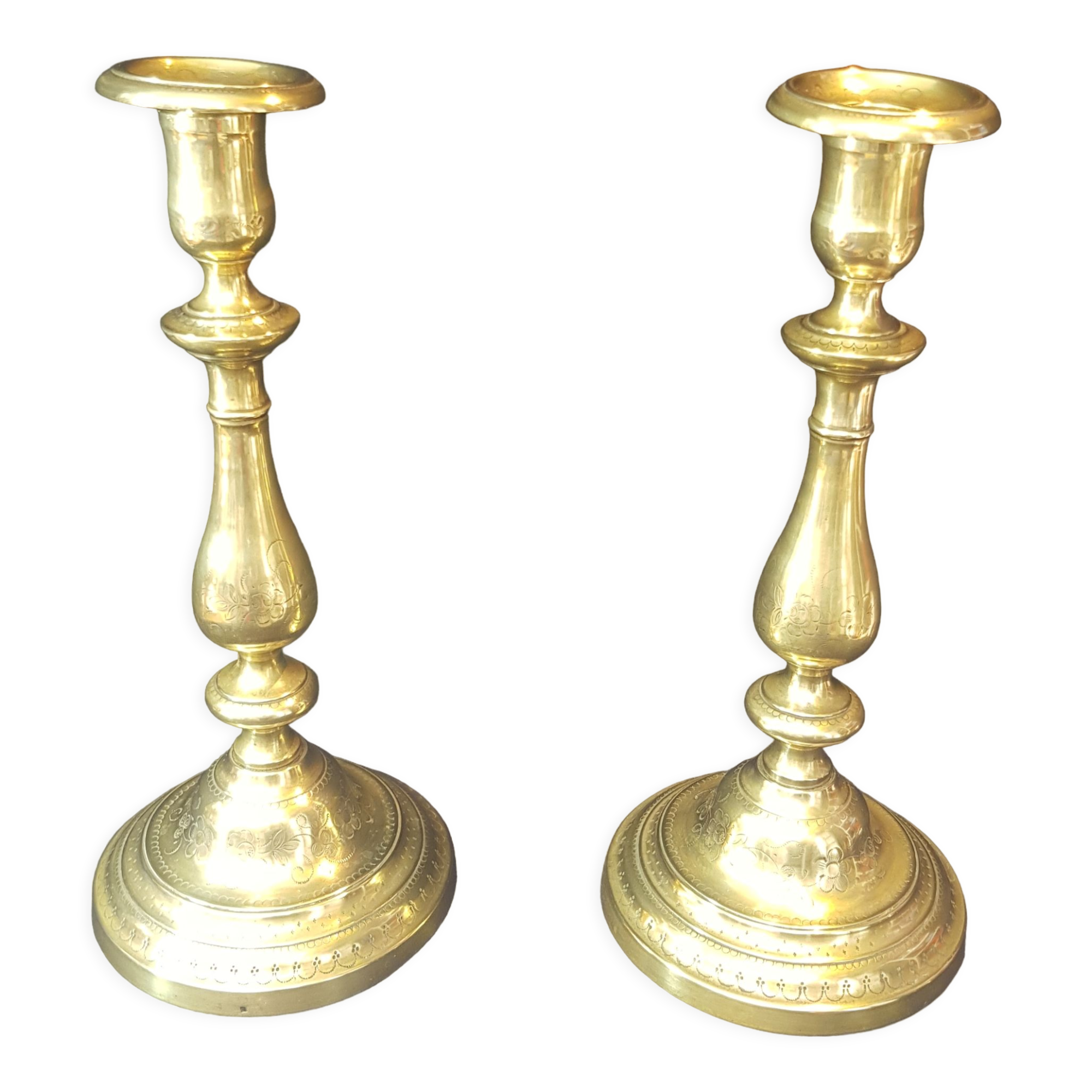 Chiseled gilded metal candlesticks