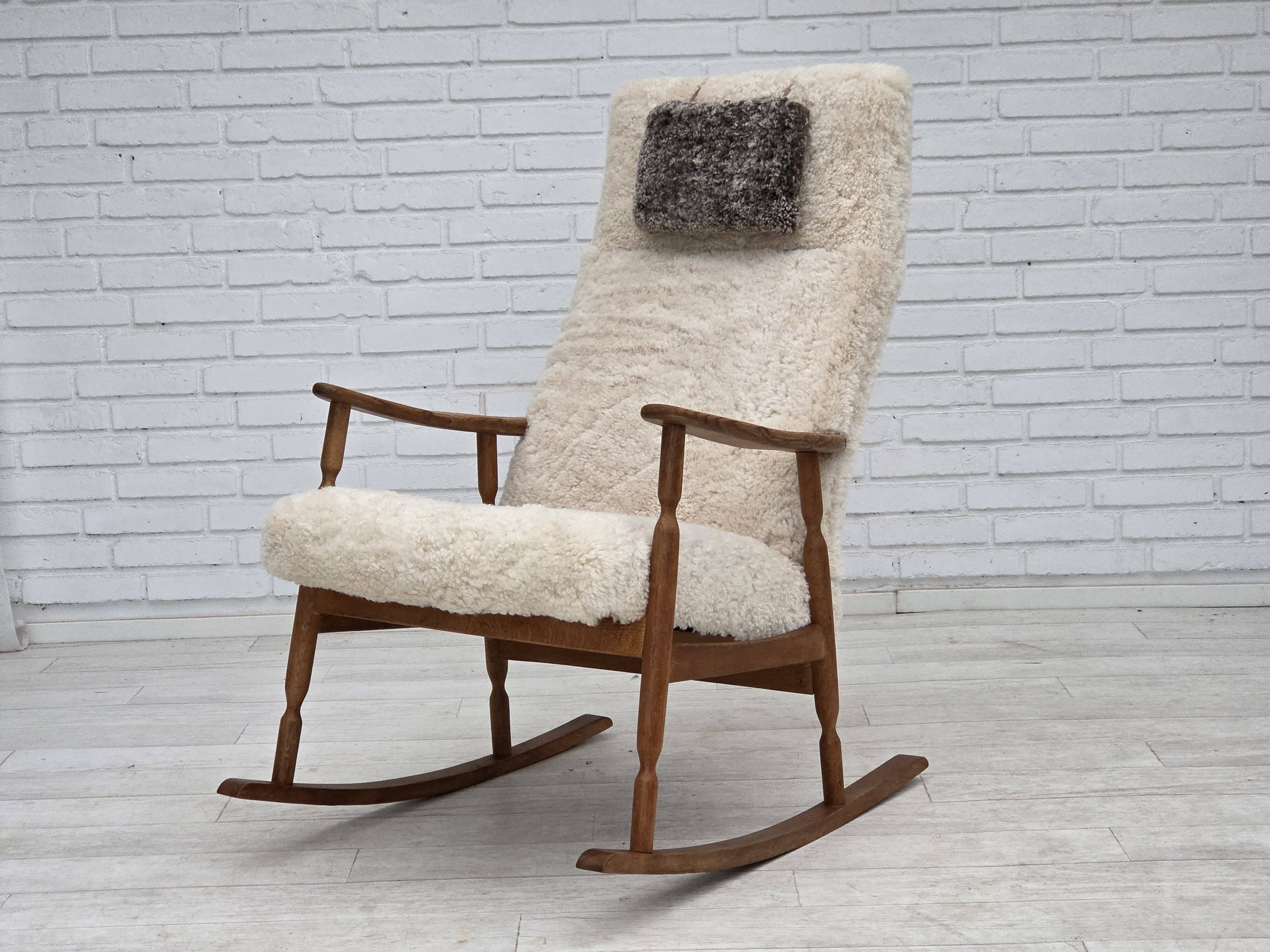 1970s, Danish rocking chair, reupholstered in quality genuine sheepskin.