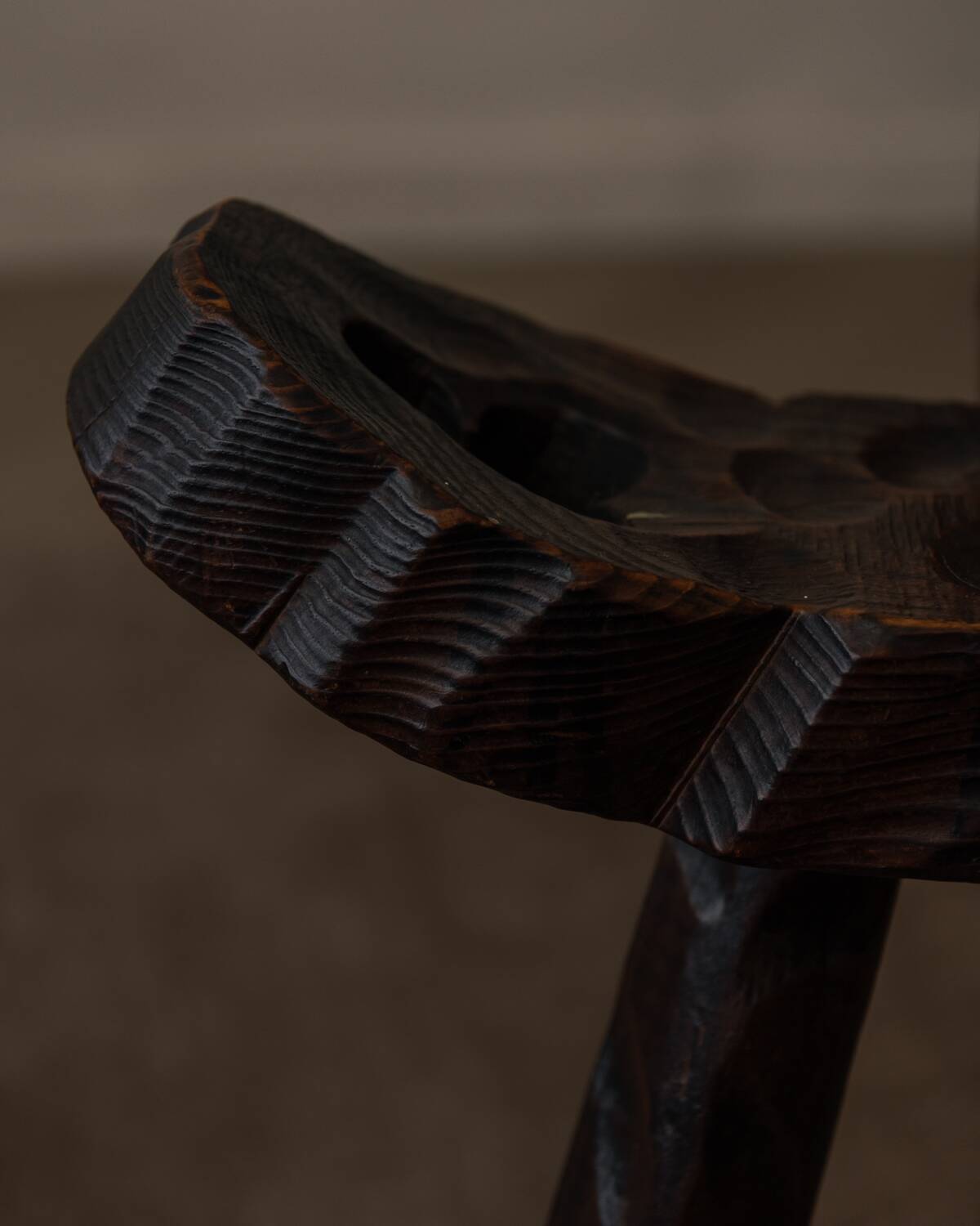 Spanish brutalist tripod chair in carved solid wood