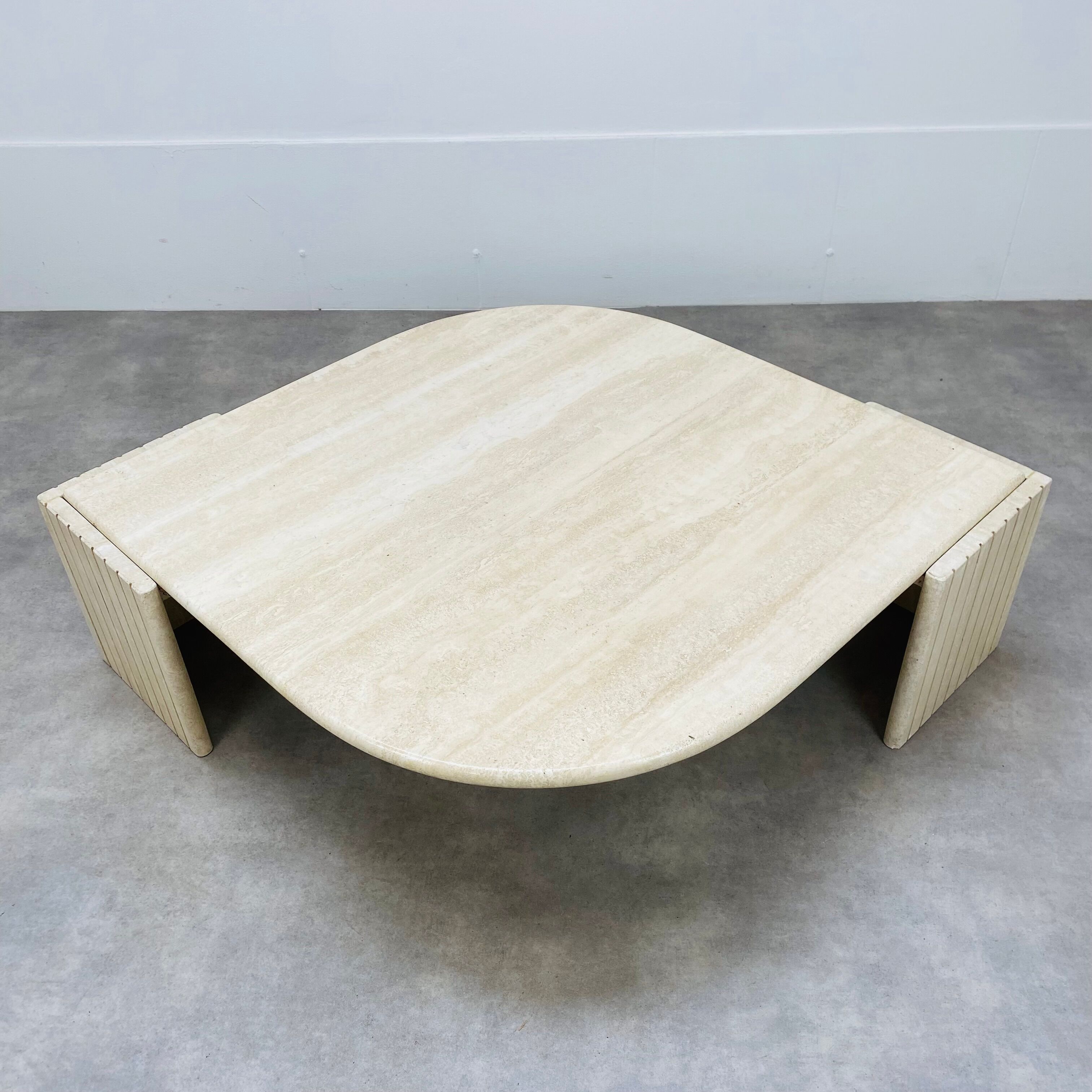 Travertine eye coffee table Roche Bobois