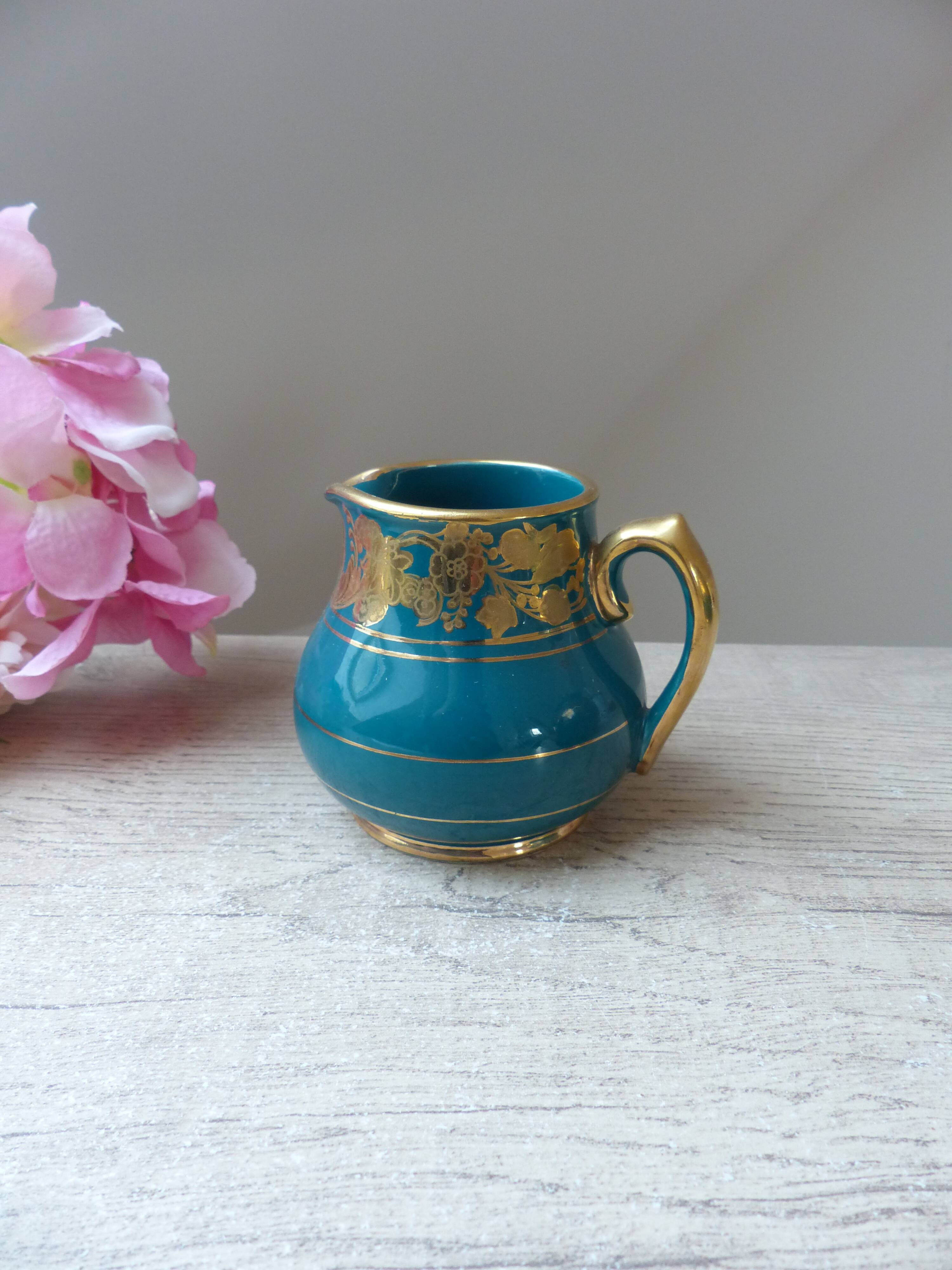 Old small Sadler cream pot in blue green ceramic with gold pattern, English creamer milk pot