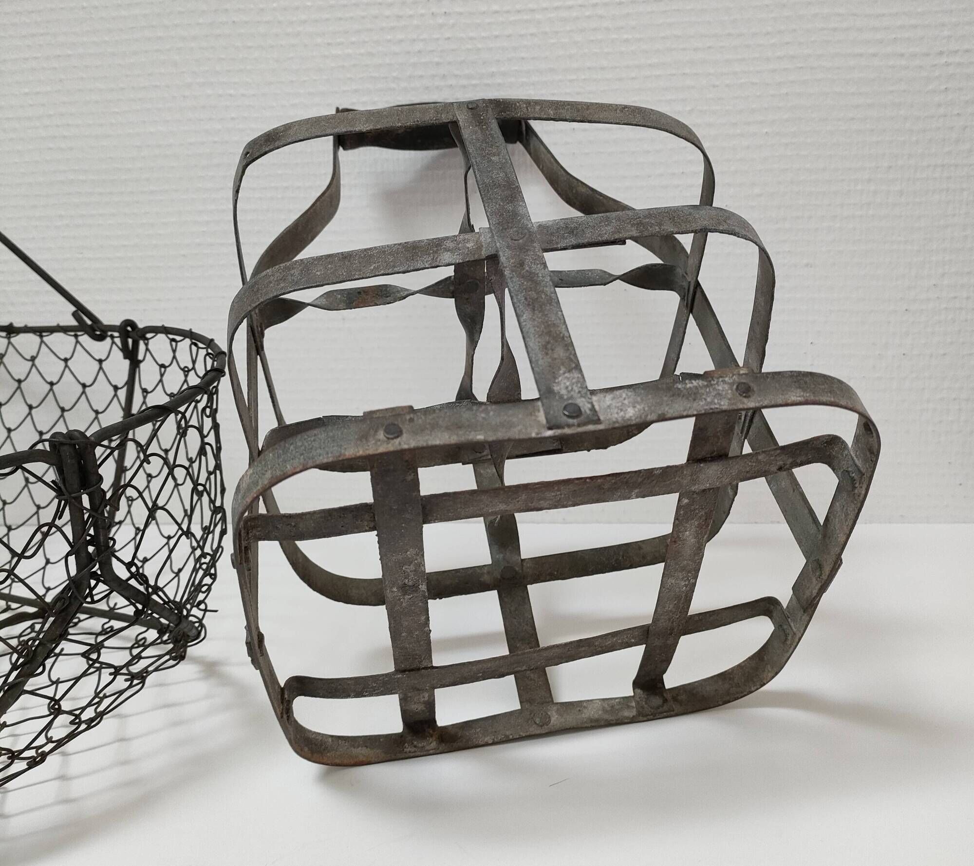 Two baskets metal and patinated wood early twentieth century
