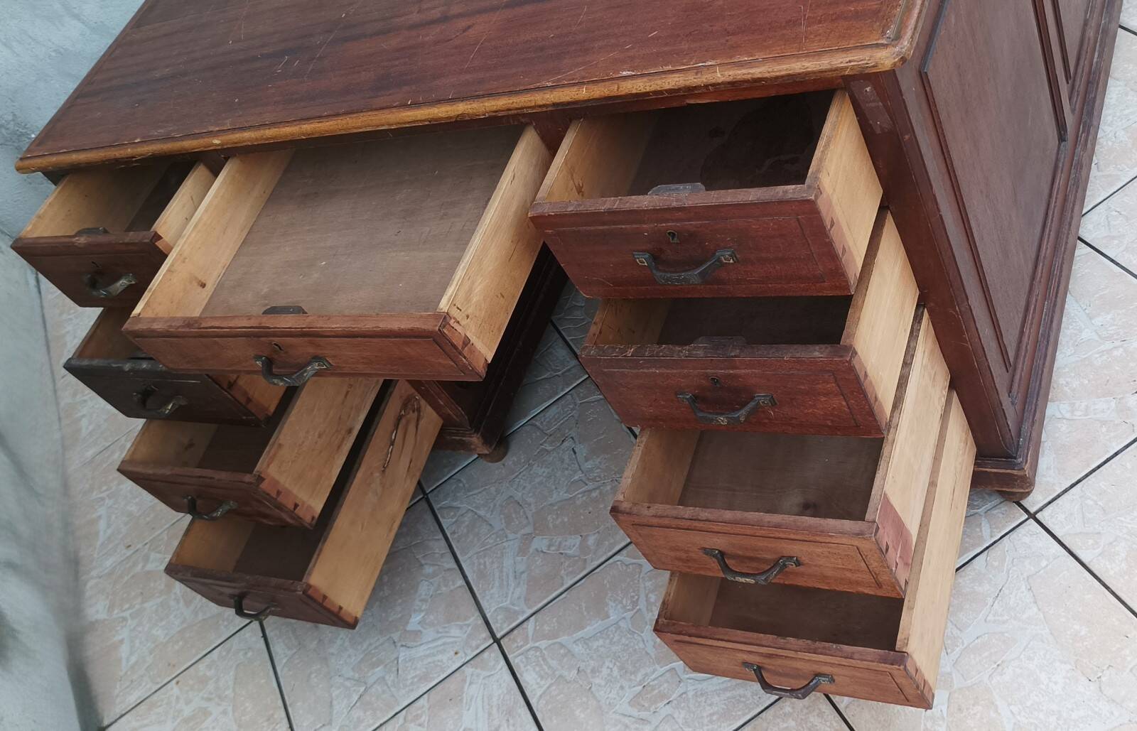 Vintage double-sided mahogany desk with 18 drawers.