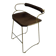 Sculptural kitchen bar stool with brass metal backrest and black leather.