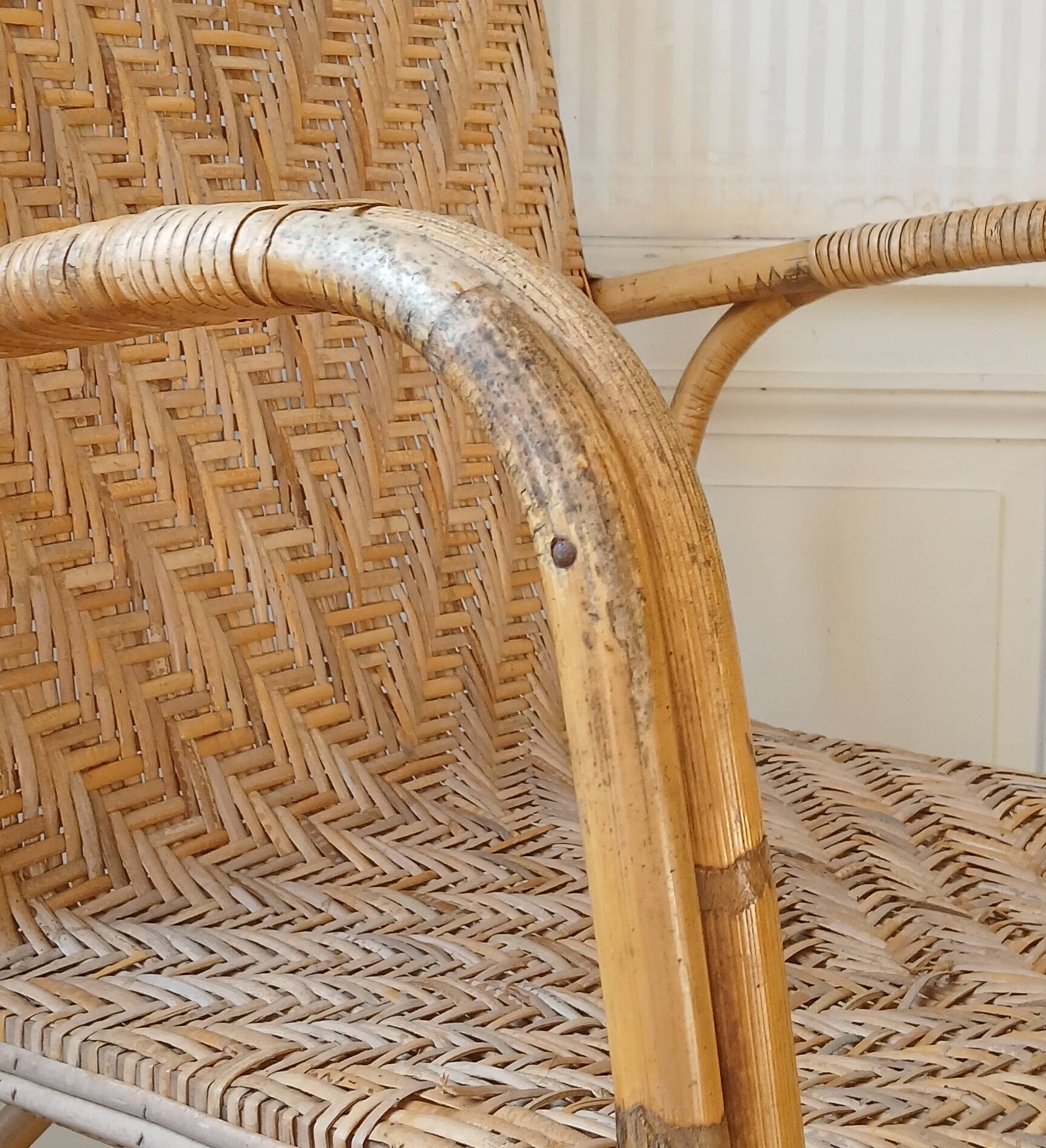 High-backed adult rattan armchair, circa 1960