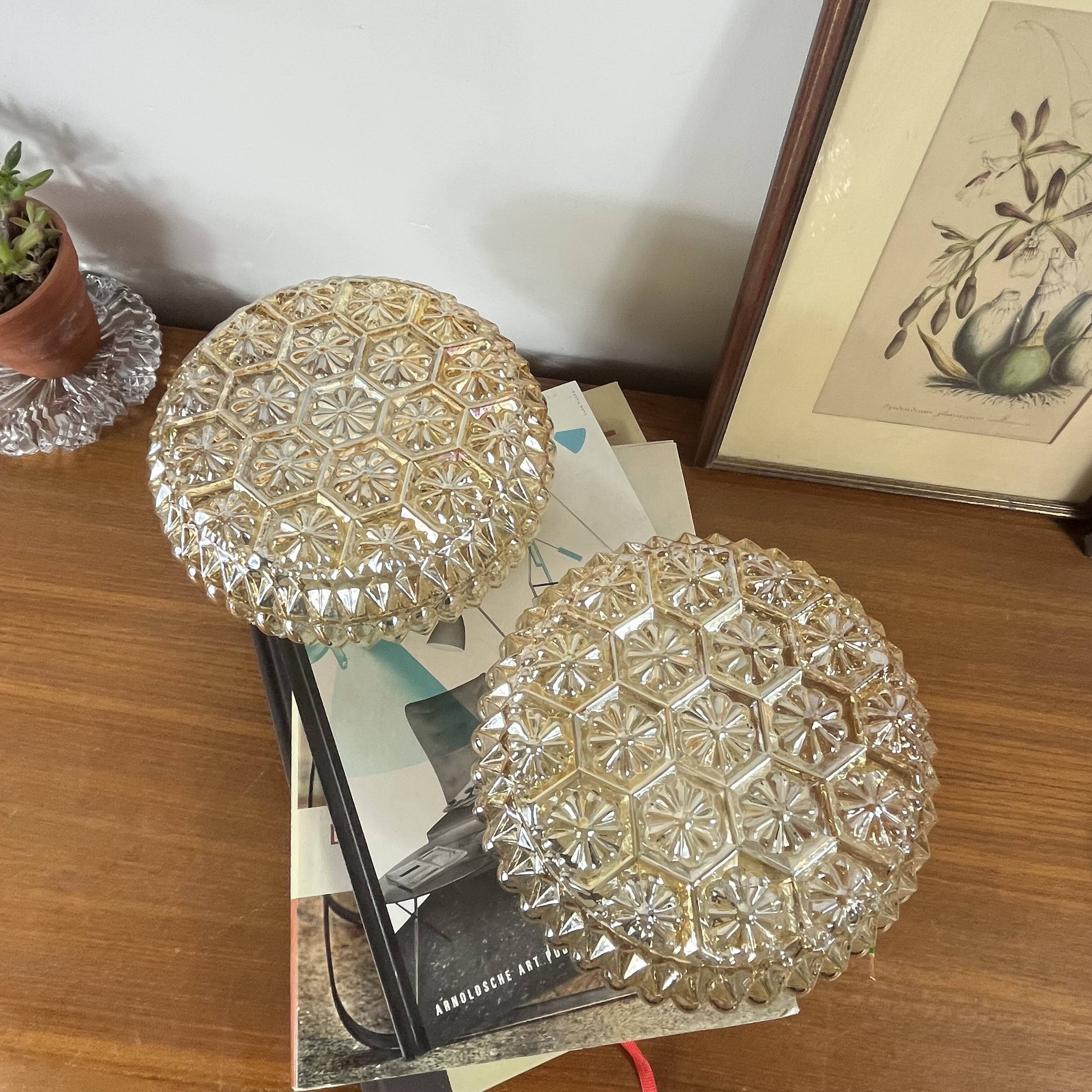 Pair of amber glass ceiling sconces with small vintage flowers.
