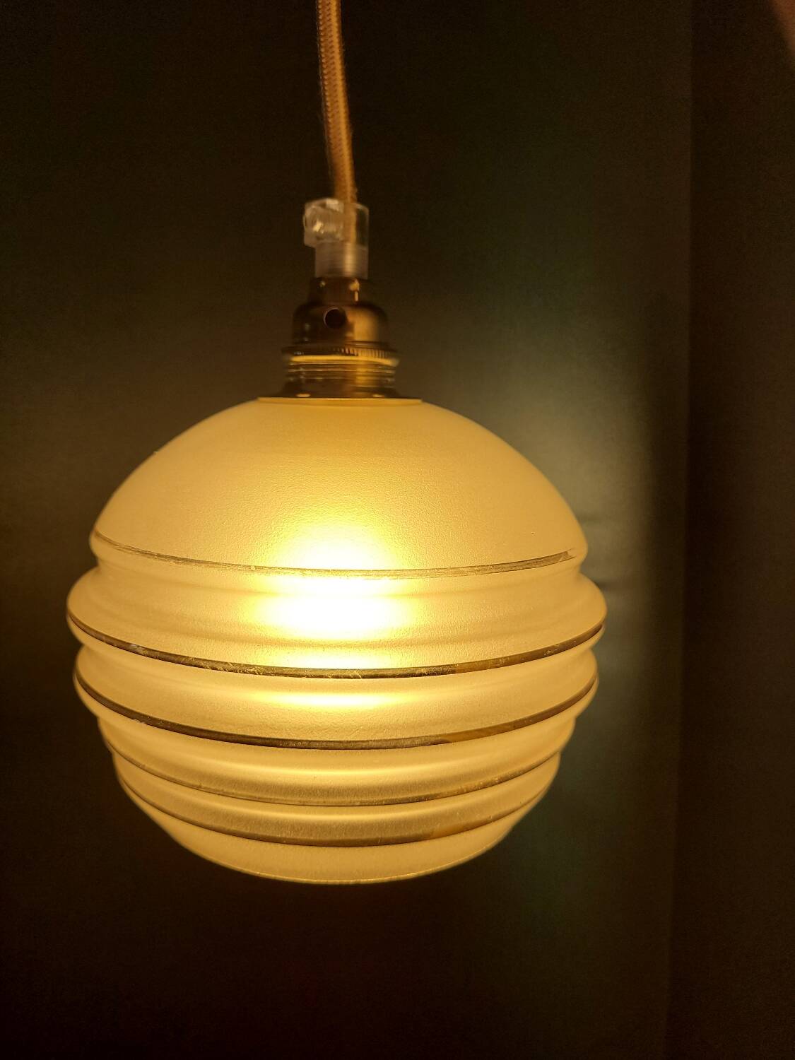 Frosted glass lamp with golden trims