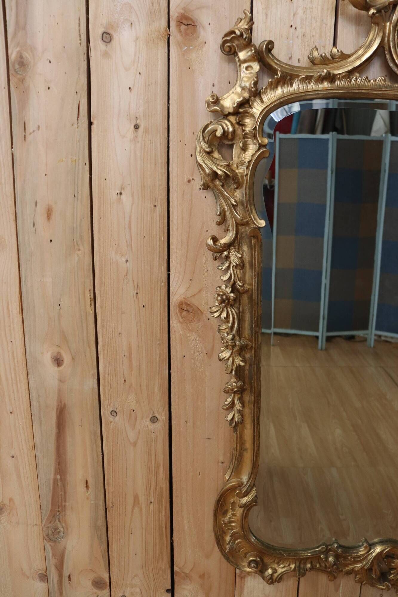 Golden wooden mirror in Louis XV style