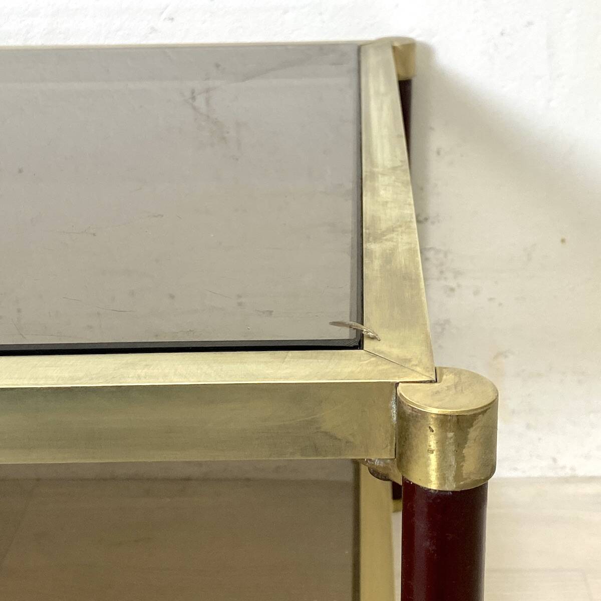 Vintage 1970s gold metal and smoked glass coffee table.