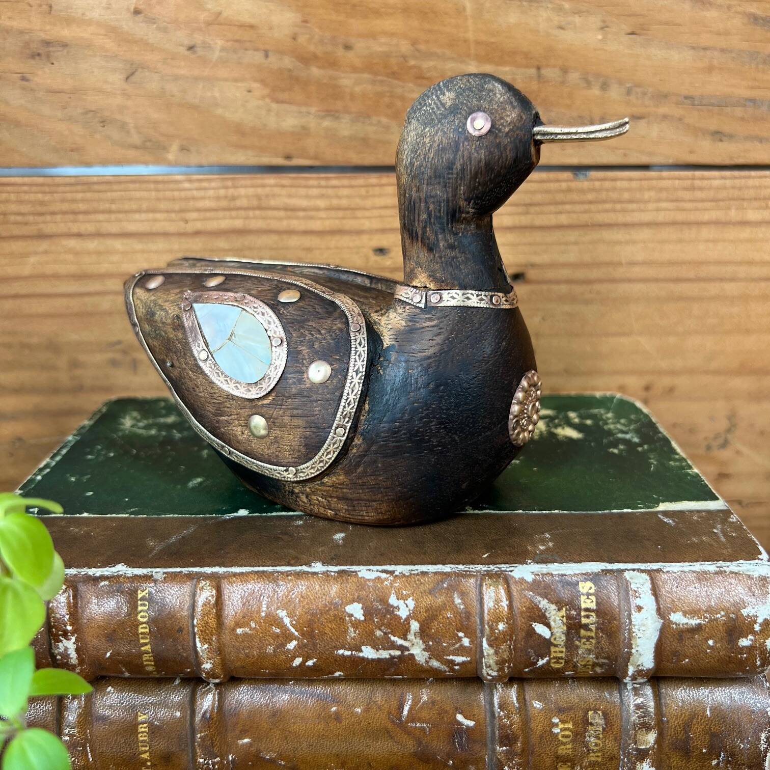 Bird in dark wood, brass & mother-of-pearl