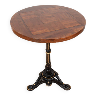 Round bistro table with wooden top and cast iron legs