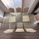 Table with a glass top and 8 chairs.