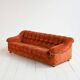Vintage rust velvet sofa from the 1970s with metal details.