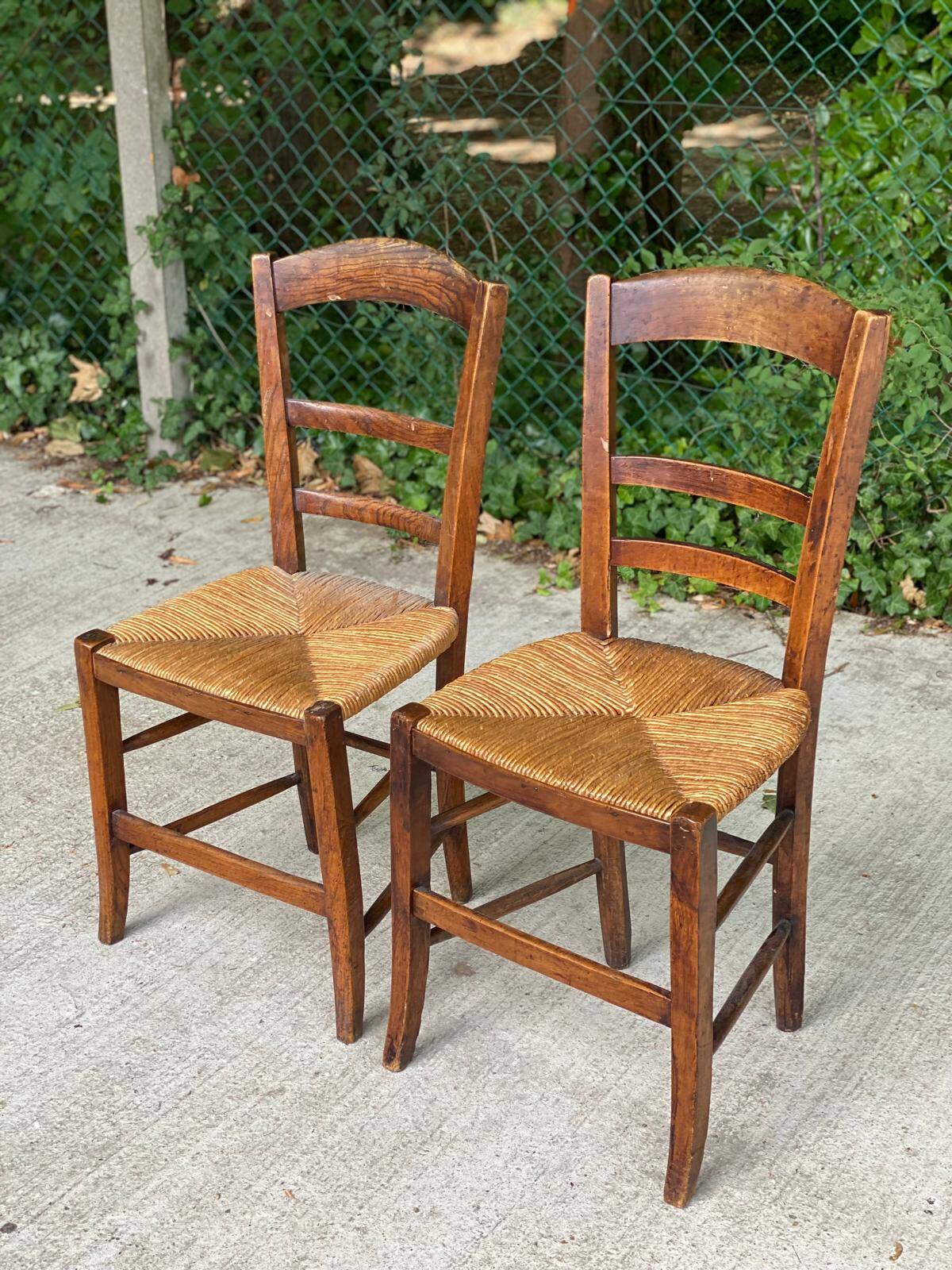 2 solid oak and straw wood chairs