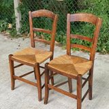 2 solid oak and straw wood chairs