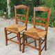 2 solid oak and straw wood chairs