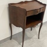 Stylized bedside table with curved shapes