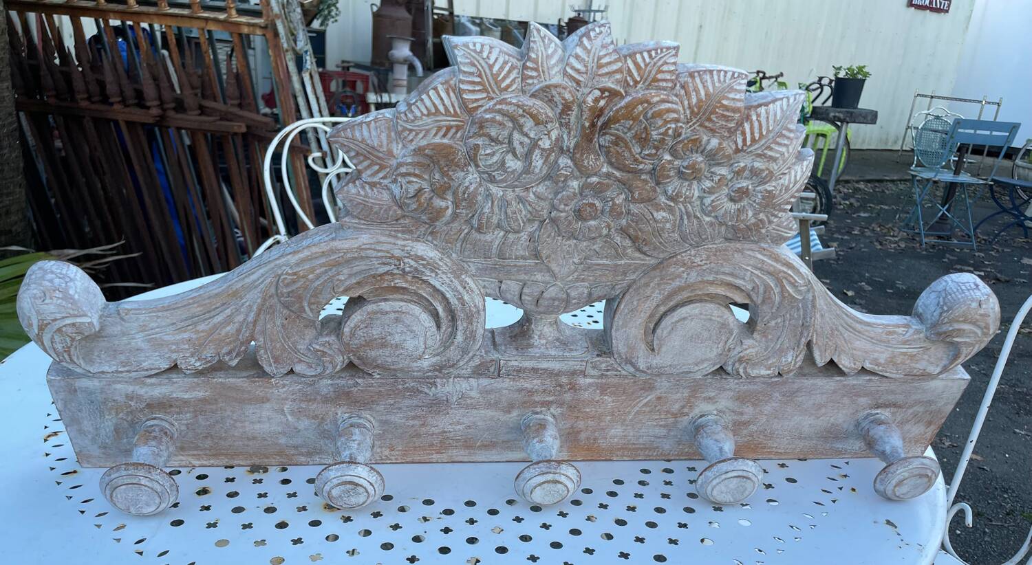 Raw carved wood coat rack