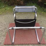 Design armchair with chrome metal tubular base and seat in black Skaï