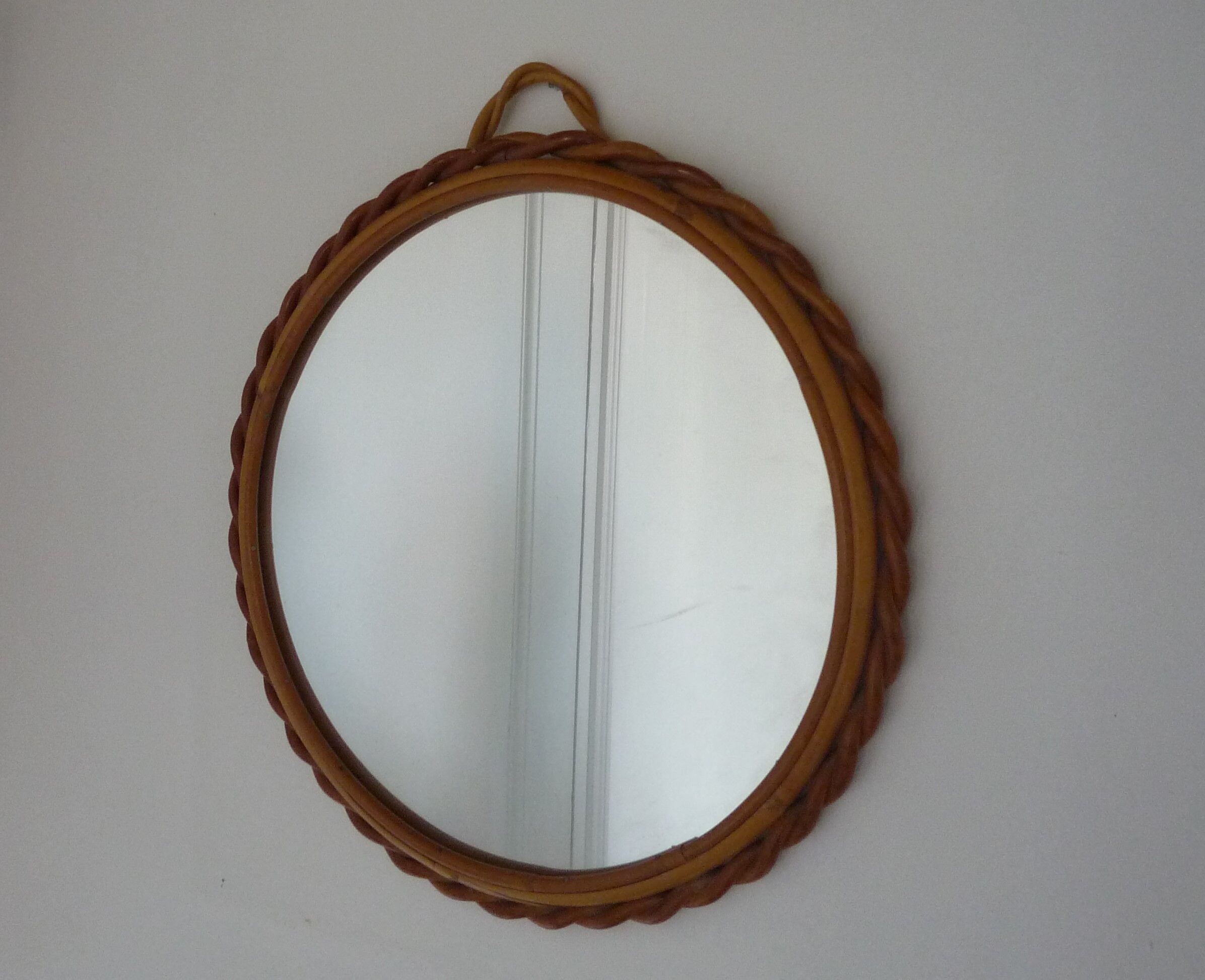 Small round mirror with rattan frame, vintage 70s