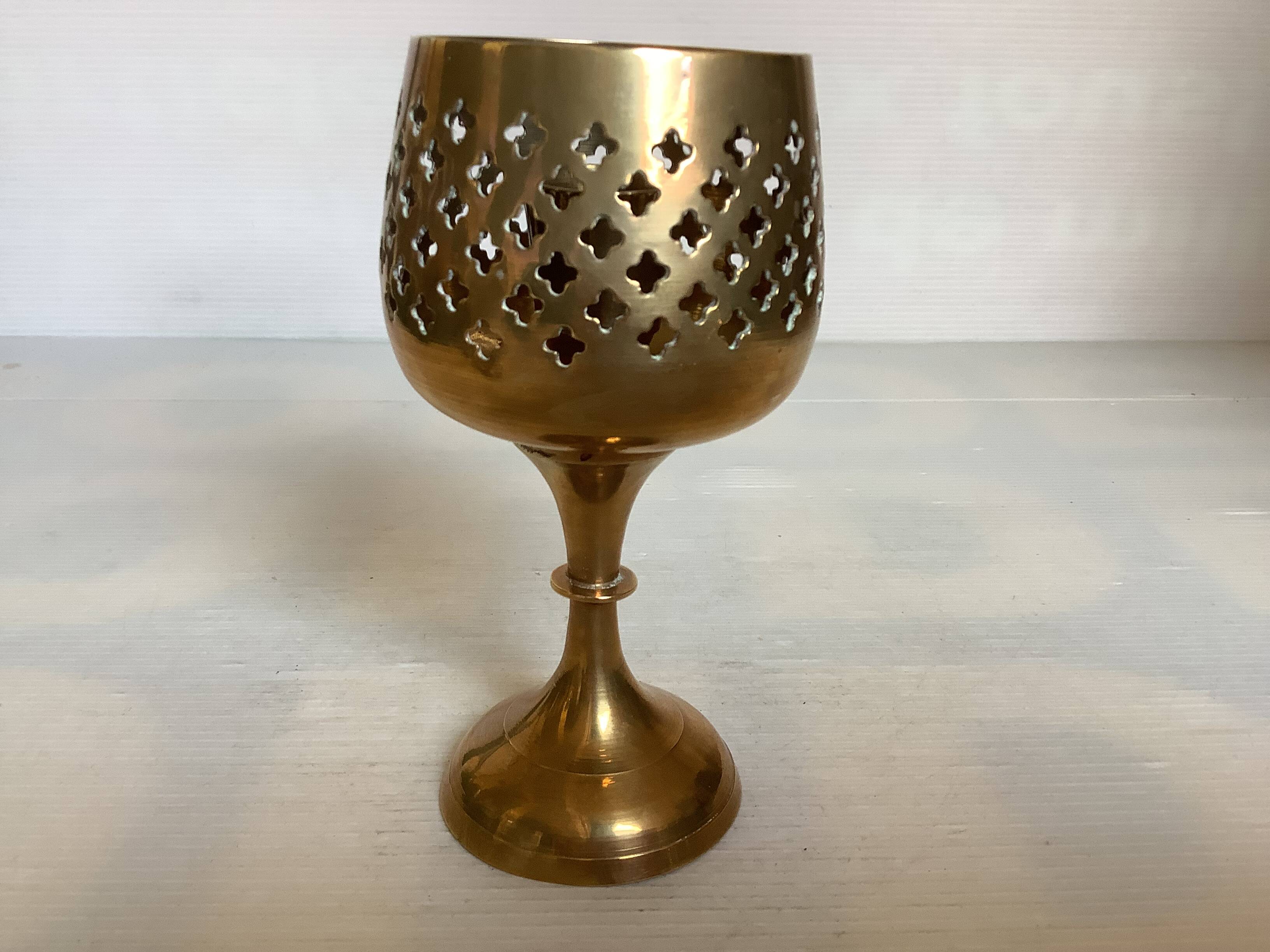 Lattice brass catchall and candlestick.