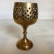 Lattice brass catchall and candlestick.