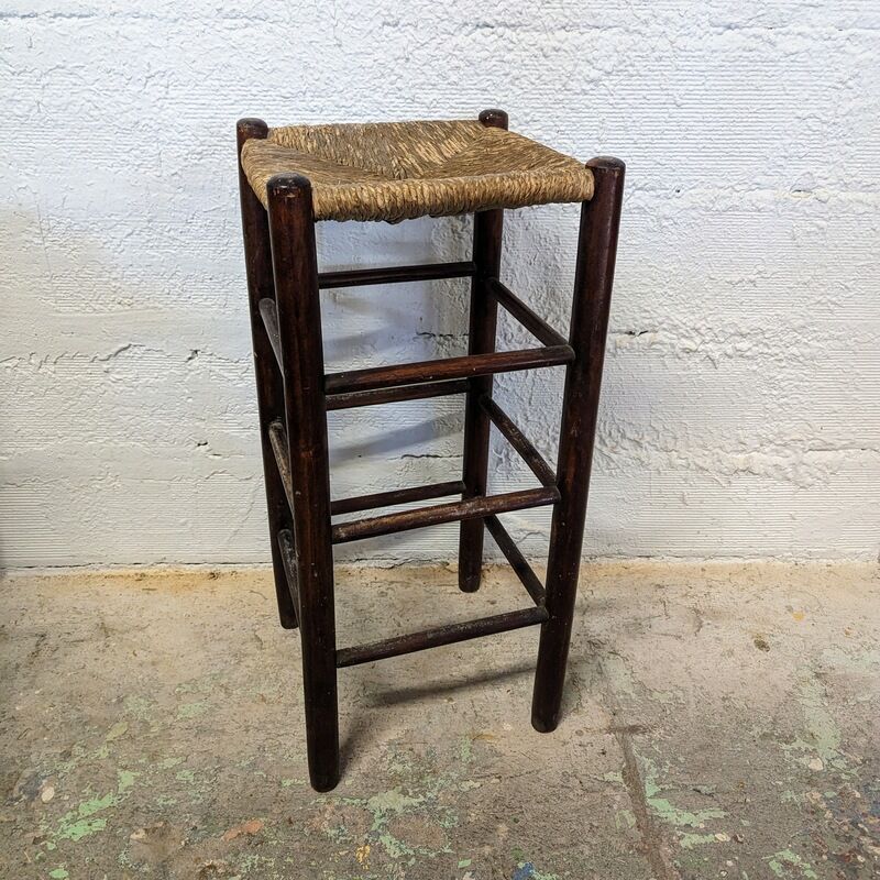 High wooden stool and straw
