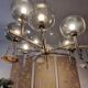 Timeless modern Scandinavian / mid-century chandelier in chrome and smoked glass.