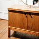 Vintage oak cabinet with circular mirror, 1960s modernist design.