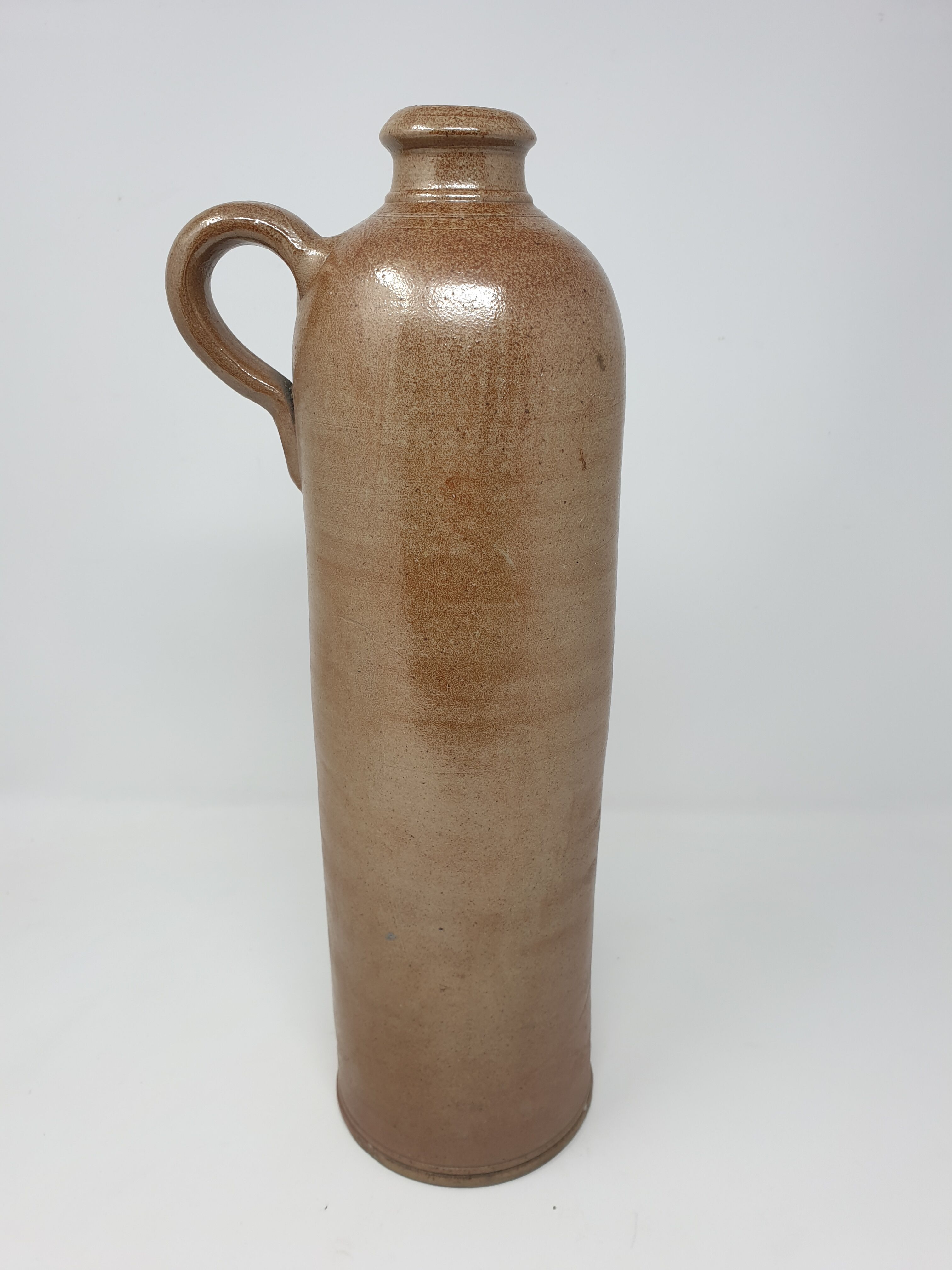 Old stoneware bottle with handle