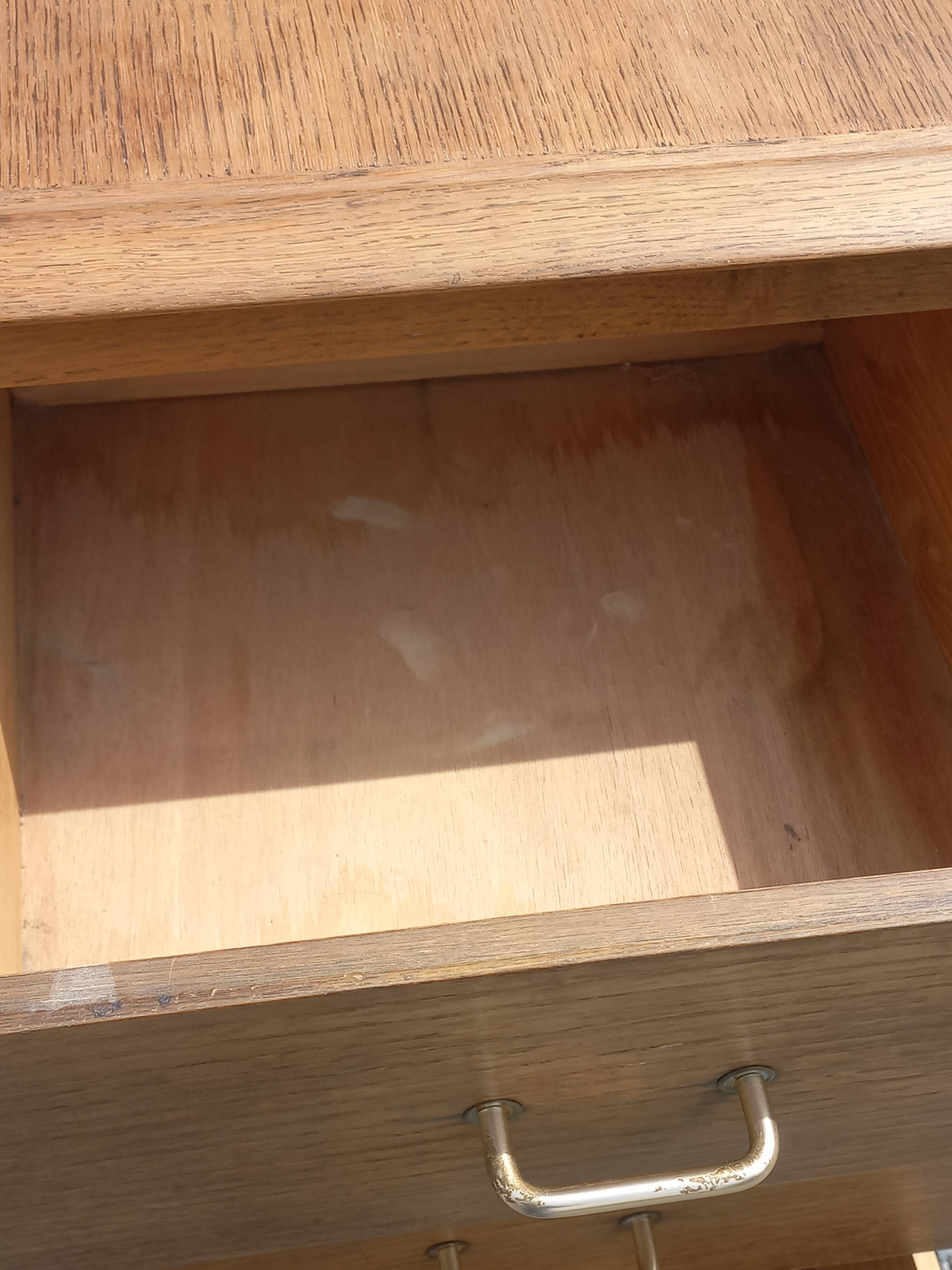 Vintage oak chest of drawers with tapered legs from the 1950s.