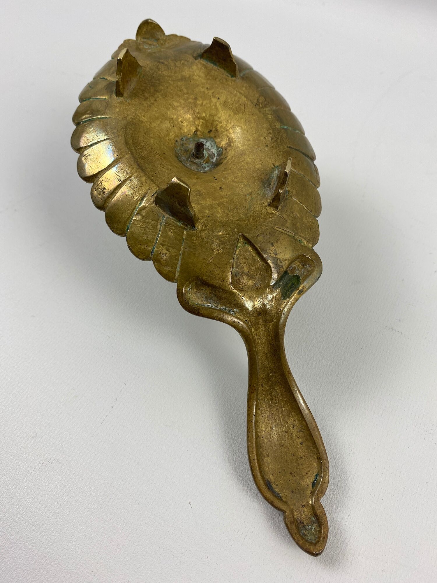 Oval brass hand-held candlestick