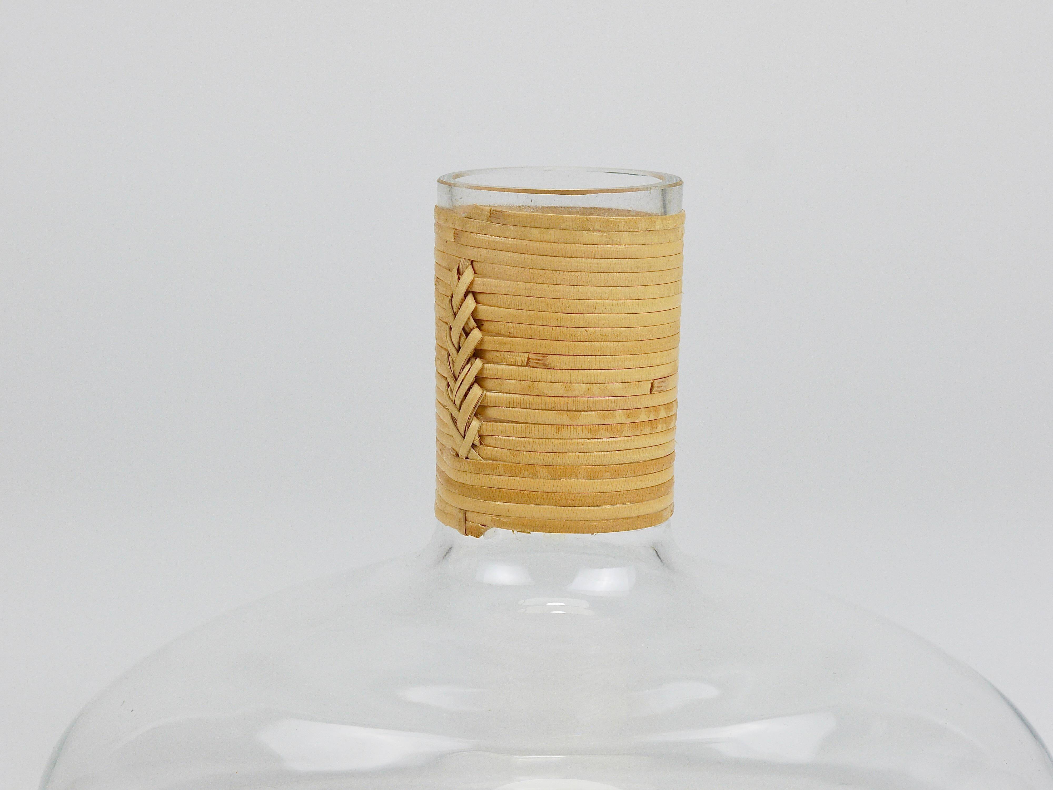 Vase by Carl Auböck decanter "Tuberkulinkolben" tall in rattan, Austria, 1950s.