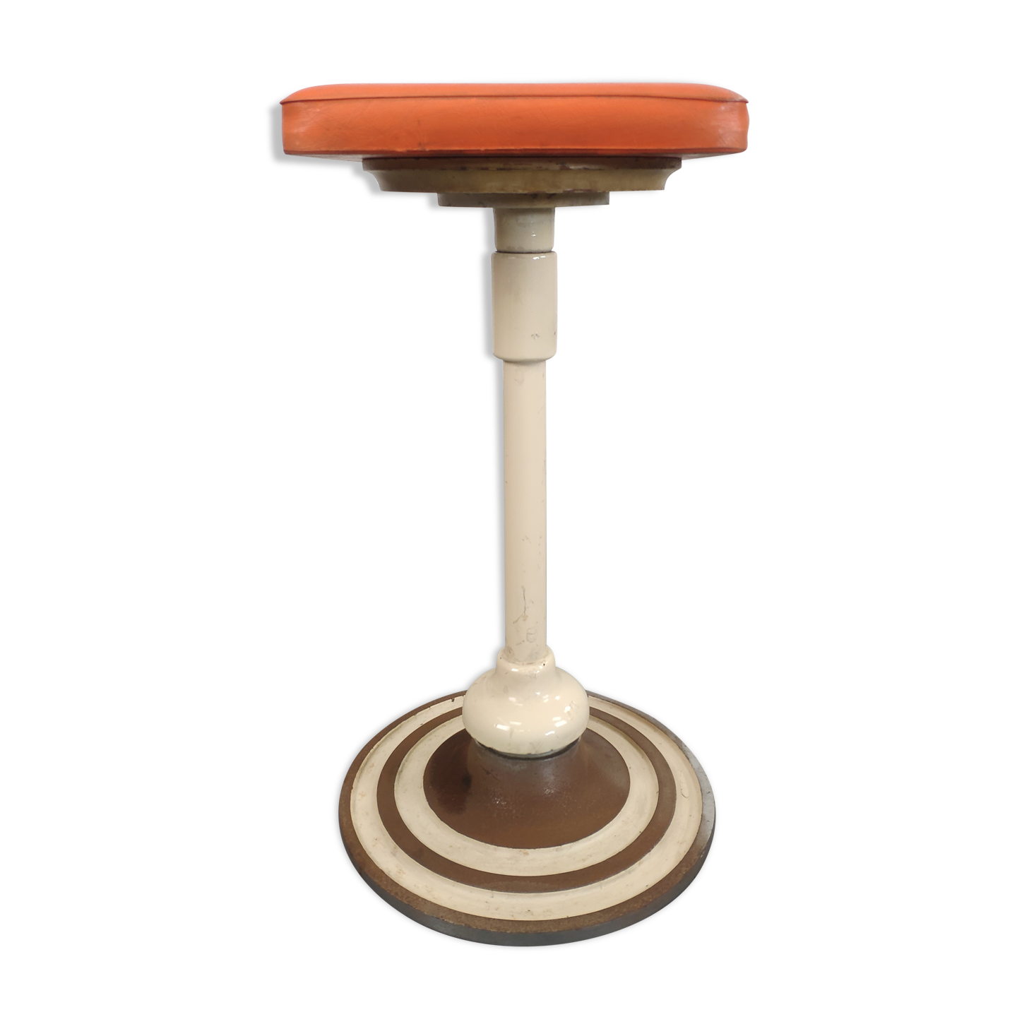 Old swivel orange sitting dentist stool