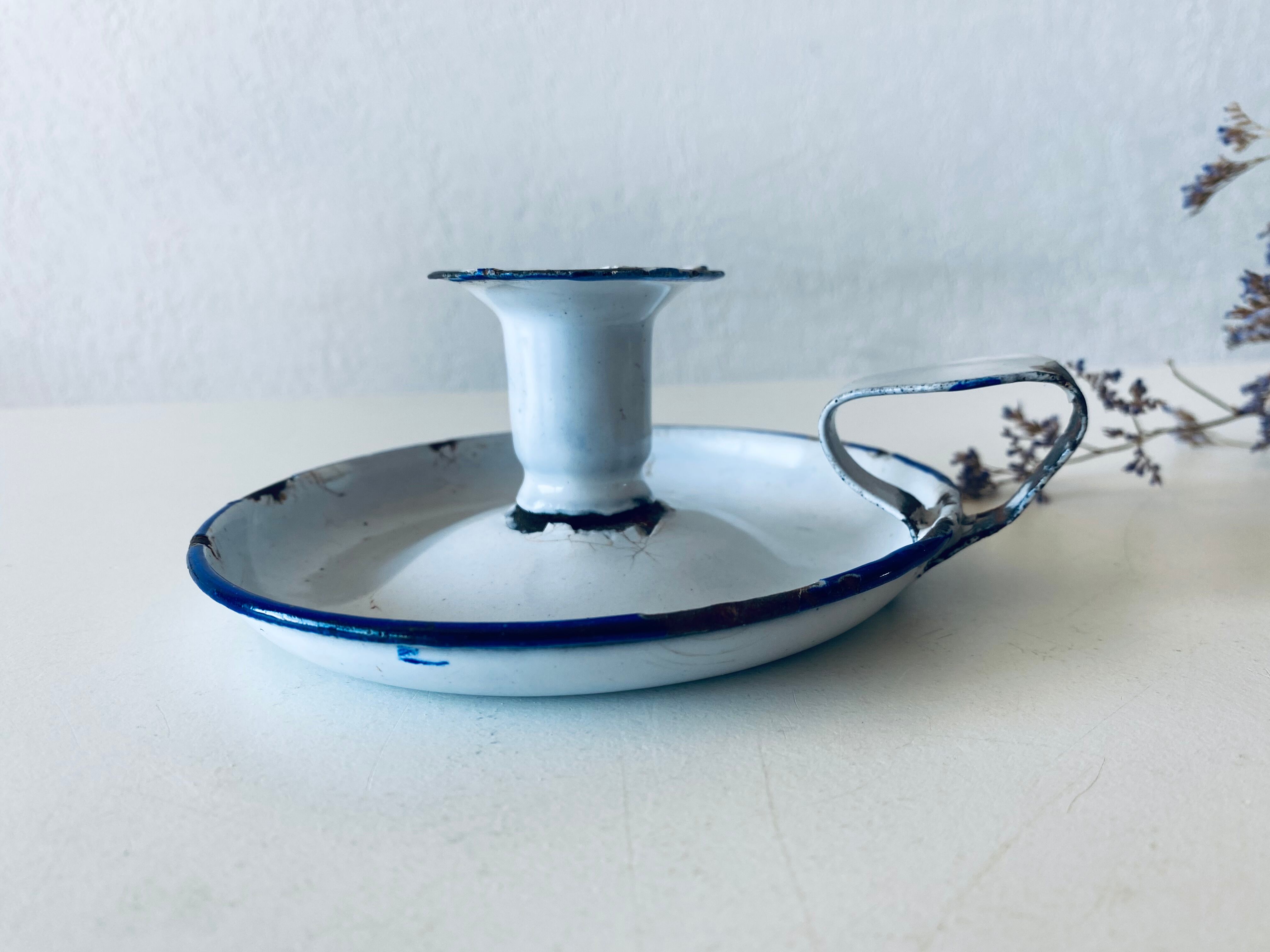 Antique candle holder in white and blue enamelled metal