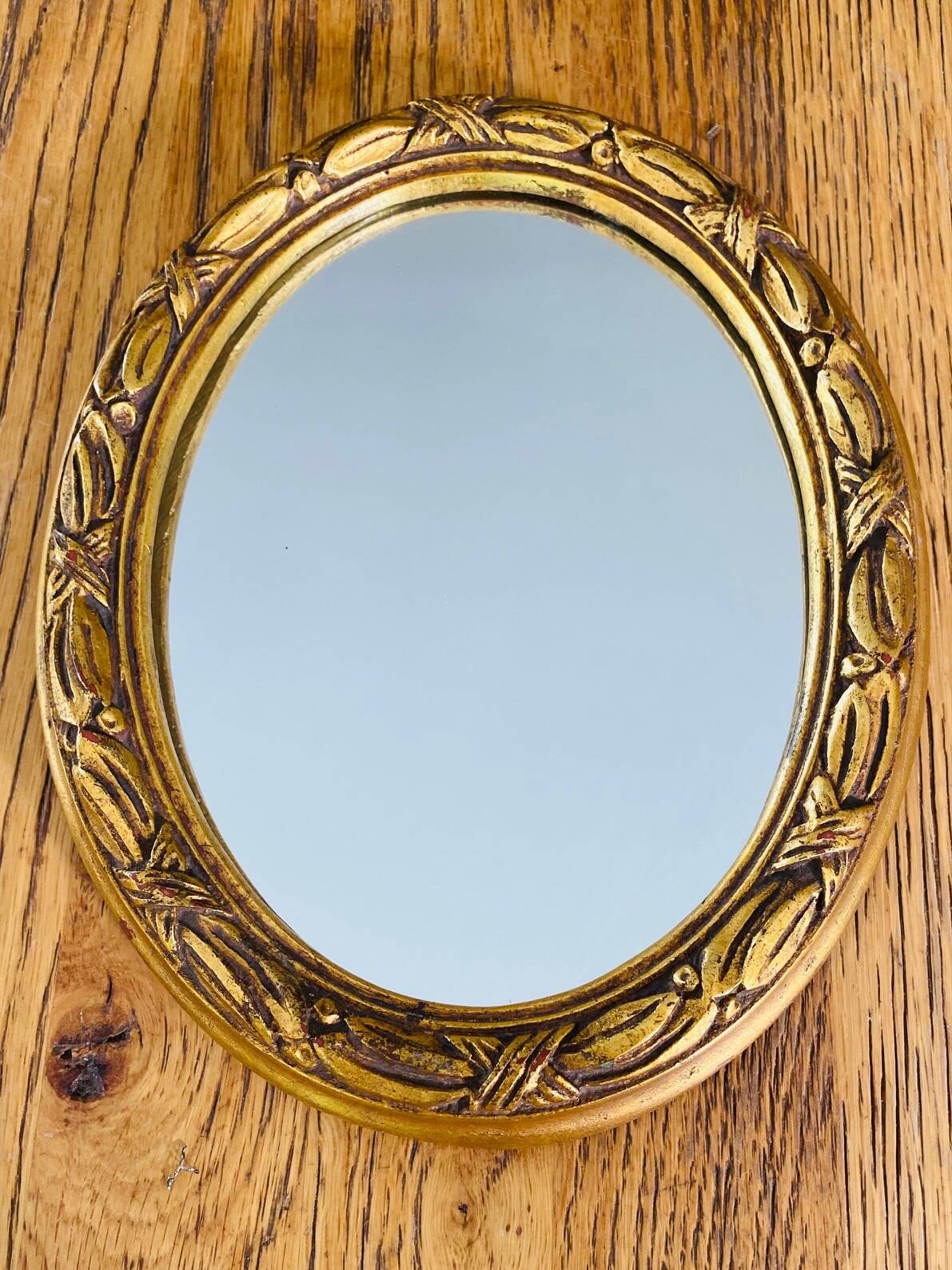 Small antique oval gilt mirror